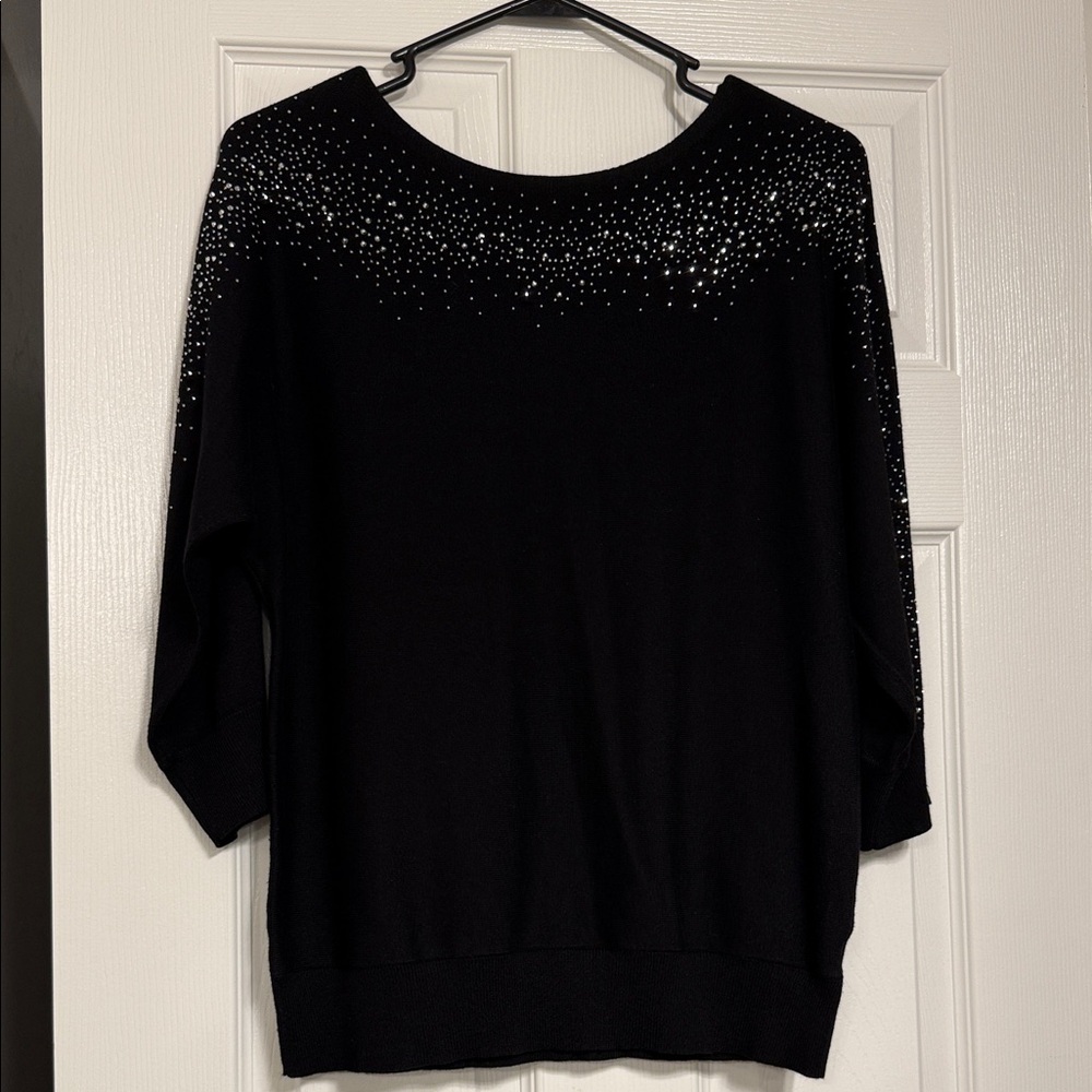 80.  Chic Black Sweater with Sparkling Details.